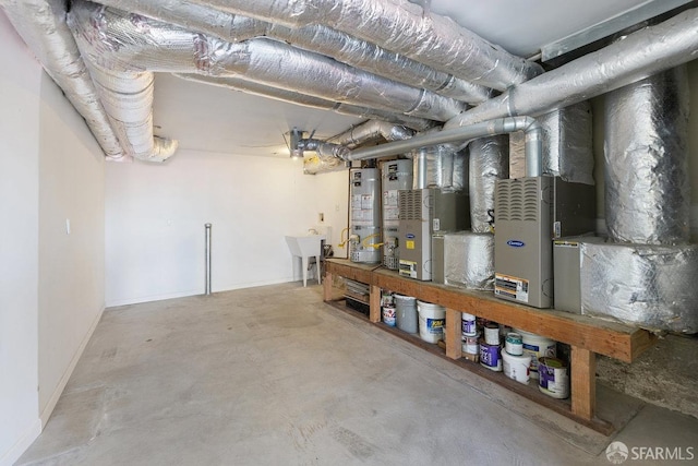 basement with water heater and sink