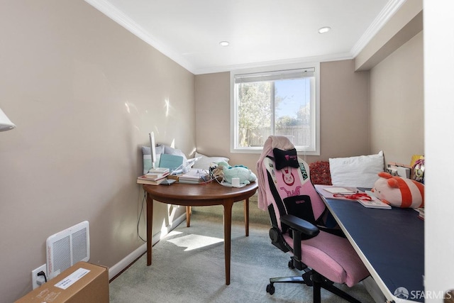 carpeted home office featuring crown molding