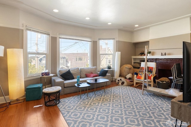 living area with hardwood / wood-style flooring