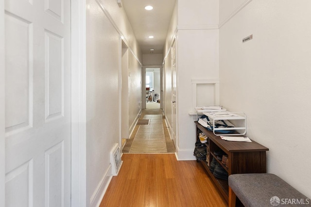 corridor featuring light hardwood / wood-style floors