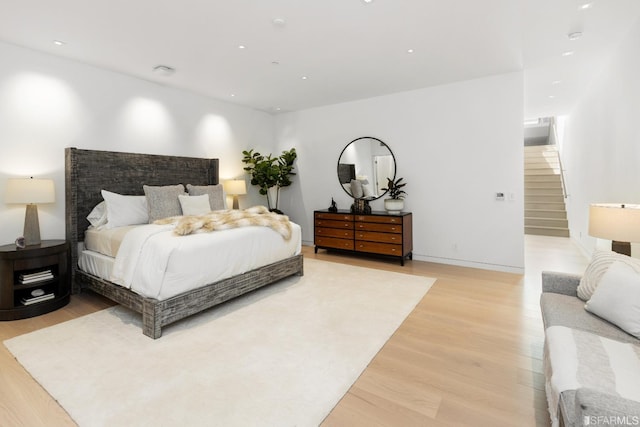 bedroom with light wood-type flooring