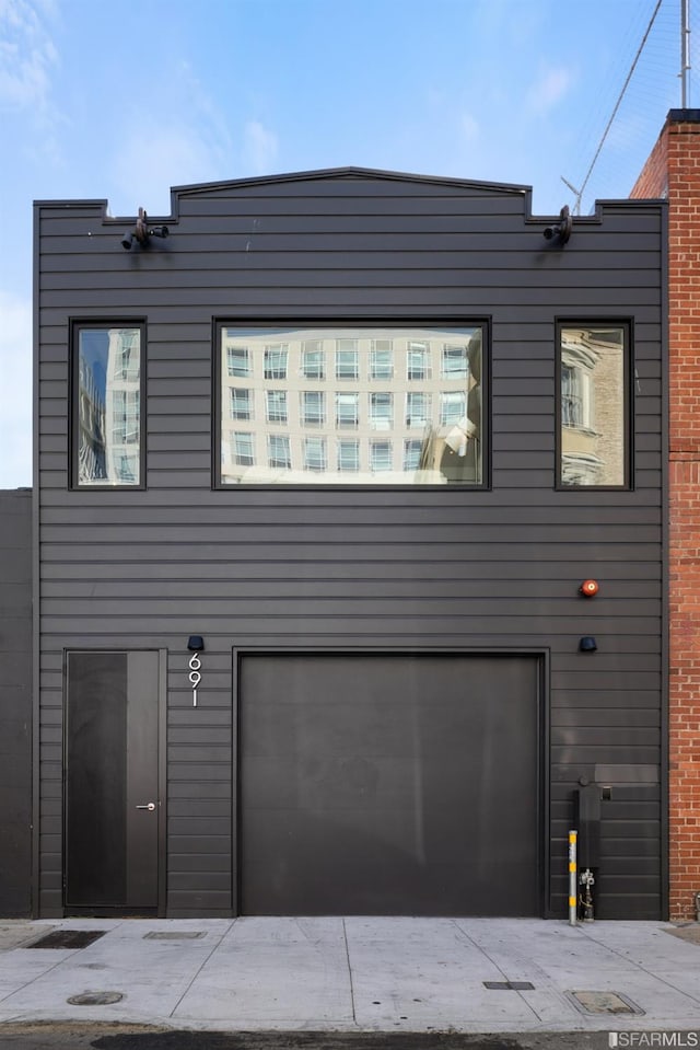 view of side of property with a garage