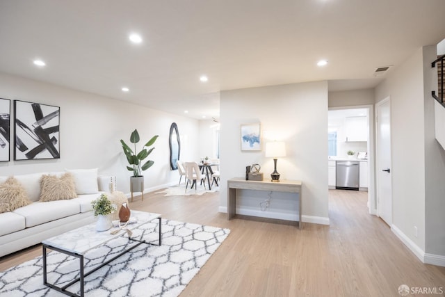 living room with light hardwood / wood-style flooring