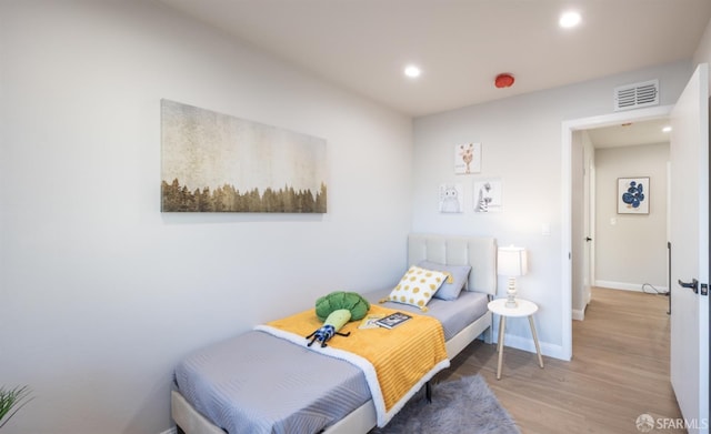 bedroom featuring wood-type flooring