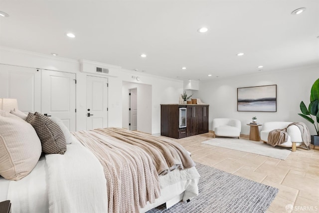 bedroom featuring a closet, visible vents, recessed lighting, and crown molding