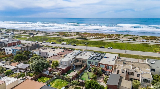 drone / aerial view featuring a residential view and a water view