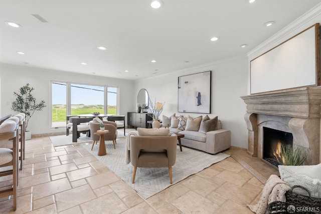 living area featuring crown molding, recessed lighting, a high end fireplace, and stone tile flooring