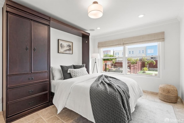 bedroom with recessed lighting and ornamental molding