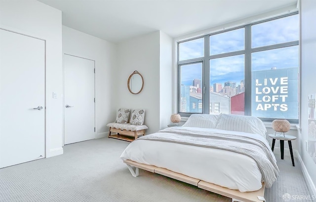 bedroom with light colored carpet