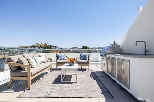 view of patio / terrace featuring area for grilling, grilling area, and an outdoor hangout area