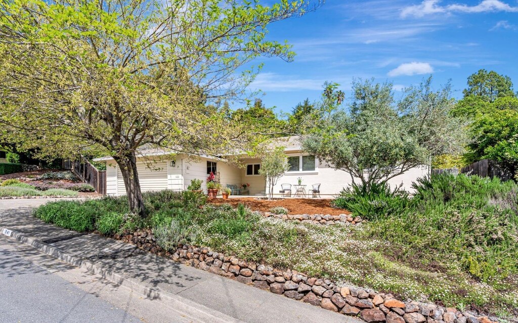 view of front of property with fence and a garage