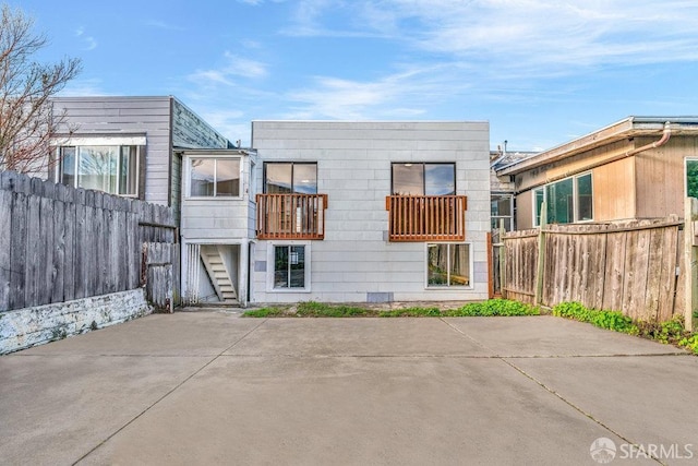 back of house with a patio