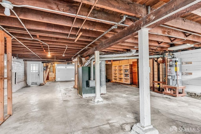 basement featuring wood walls and gas water heater