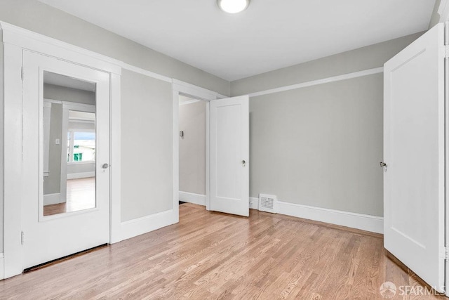 unfurnished bedroom with light hardwood / wood-style flooring