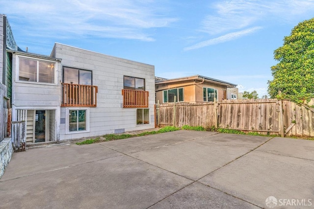 rear view of property featuring a patio area