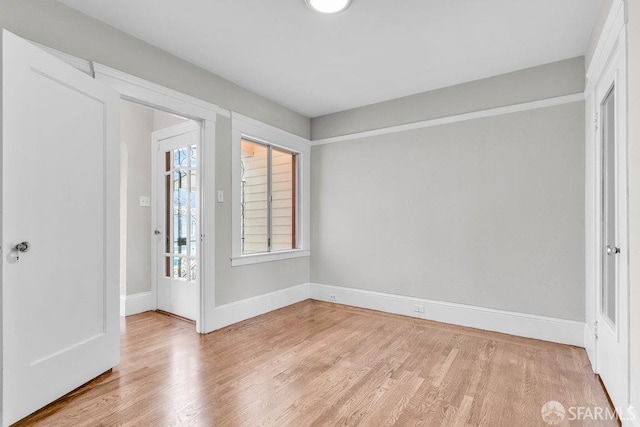 unfurnished room featuring light hardwood / wood-style floors