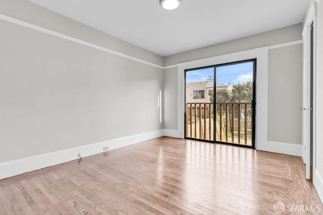 empty room with light hardwood / wood-style floors