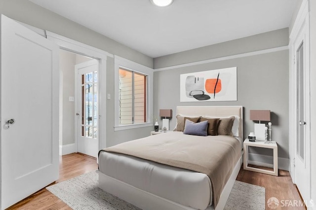 bedroom with wood-type flooring