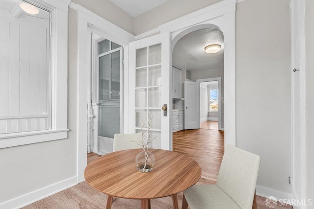 dining space with hardwood / wood-style flooring