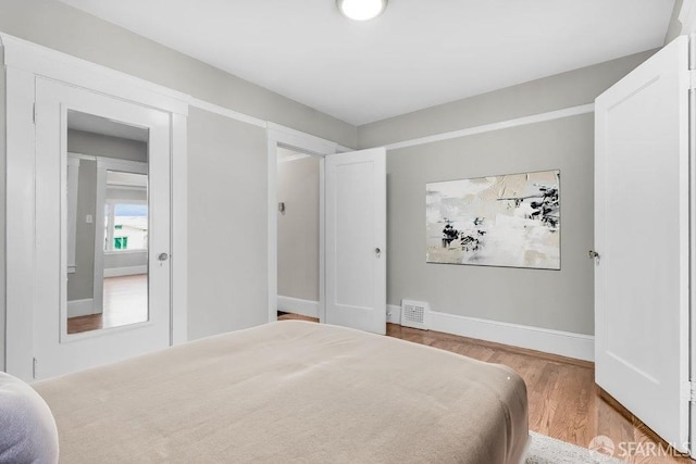 bedroom with light wood-type flooring