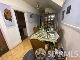 dining room featuring vaulted ceiling