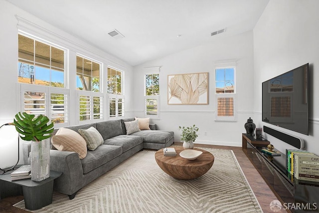 654 Tain Ct, Brentwood, CA 94513 - living area featuring wood finished floors, vaulted ceiling, and healthy amount of natural light