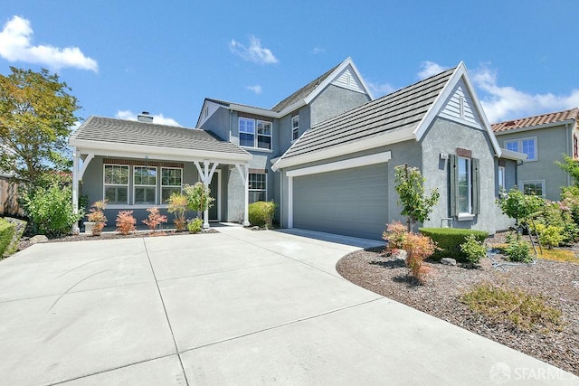 654 Tain Ct, Brentwood, CA 94513 - view of front of house with an attached garage, driveway, a tiled roof, stucco siding, and a chimney