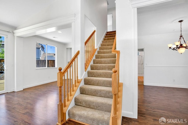 654 Tain Ct, Brentwood, CA 94513 - stairway with wood finished floors, a chandelier, and ornamental molding