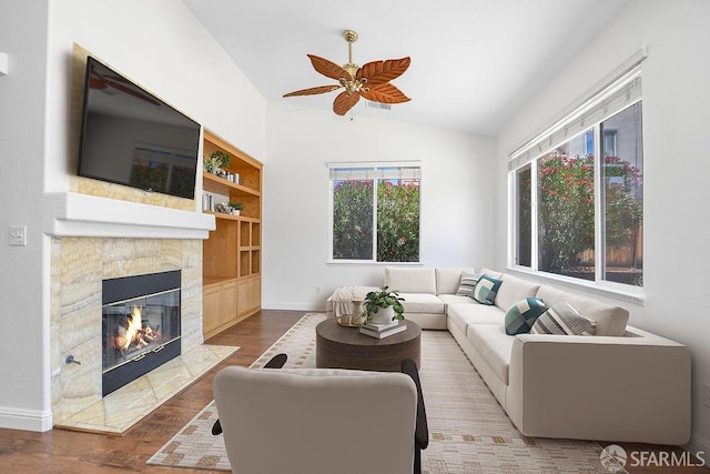 654 Tain Ct, Brentwood, CA 94513 - living area featuring lofted ceiling, a high end fireplace, wood finished floors, ceiling fan, and built in features