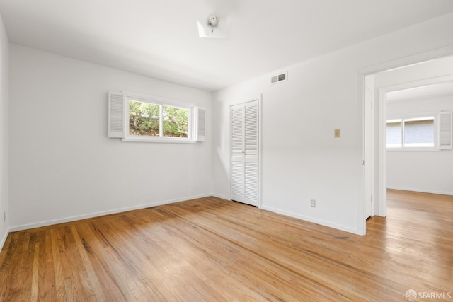 971 Lupin Way Lower, Lower, San Carlos, CA 94070 - unfurnished bedroom with light wood-style floors, a closet, and baseboards
