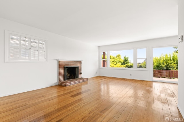 971 Lupin Way Lower, Lower, San Carlos, CA 94070 - unfurnished living room with light wood-type flooring, a fireplace, and baseboards