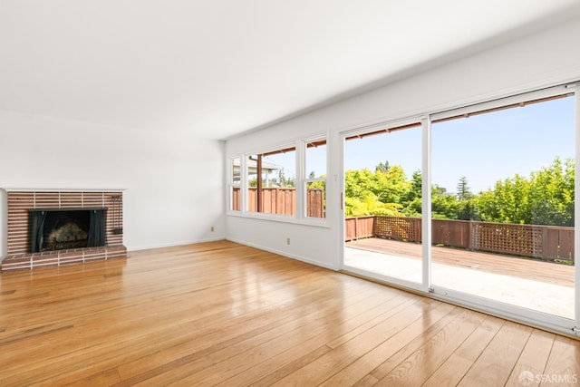 971 Lupin Way Lower, Lower, San Carlos, CA 94070 - unfurnished living room with light wood-style flooring, baseboards, and a brick fireplace