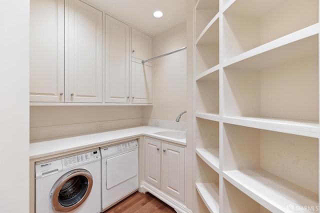2000 Washington St Unit 4, San Francisco, CA 94109 - clothes washing area with washing machine and dryer, cabinet space, light wood-style flooring, and recessed lighting