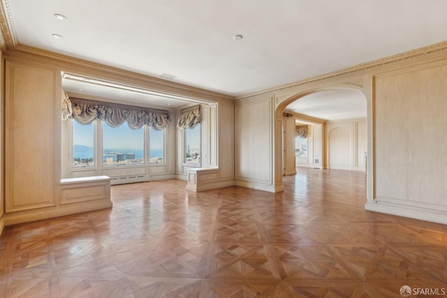 2000 Washington St Unit 4, San Francisco, CA 94109 - empty room featuring a decorative wall, arched walkways, and a baseboard radiator