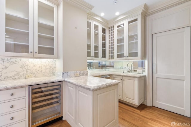 2000 Washington St Unit 4, San Francisco, CA 94109 - bar area featuring beverage cooler, light wood-type flooring, crown molding, a sink, and tasteful backsplash