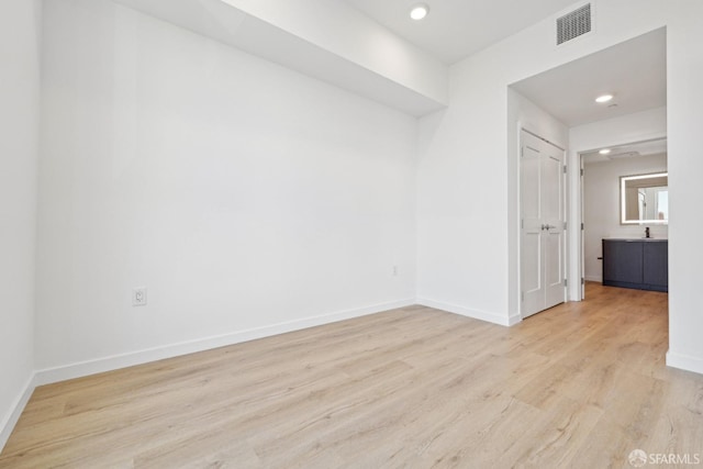 unfurnished room featuring light hardwood / wood-style floors