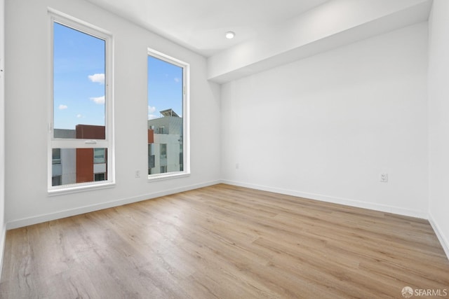 unfurnished room featuring light hardwood / wood-style flooring