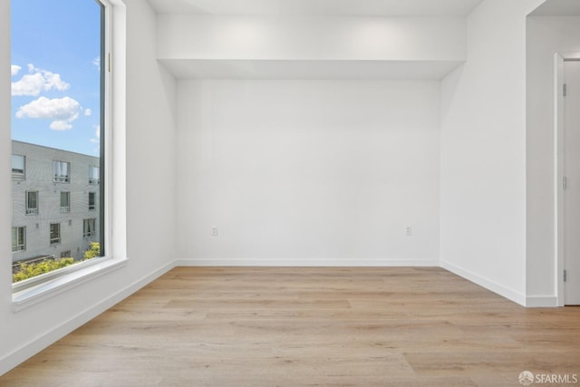 empty room with light wood-type flooring