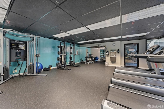 gym featuring a drop ceiling