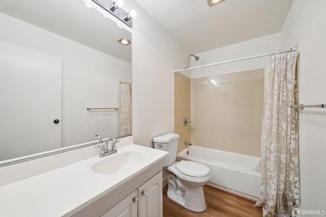 full bathroom featuring vanity, toilet, hardwood / wood-style flooring, and shower / bath combo