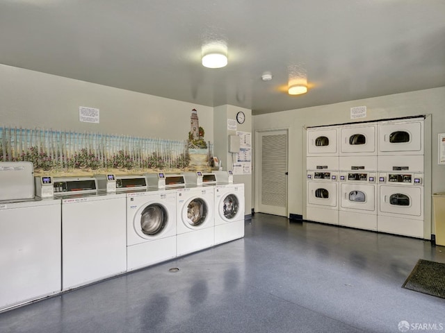 laundry area featuring stacked washer and clothes dryer and independent washer and dryer