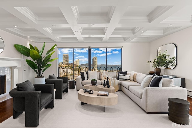 living room featuring beamed ceiling, coffered ceiling, and a fireplace