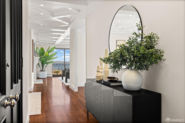 foyer with coffered ceiling, dark hardwood / wood-style floors, and beam ceiling