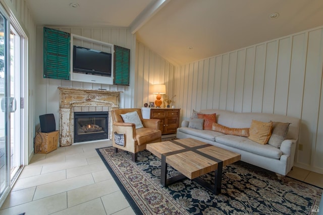 living room featuring lofted ceiling with beams and light tile patterned floors