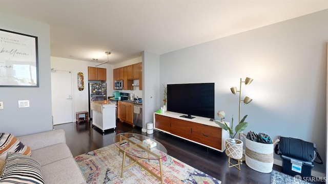 living room featuring dark hardwood / wood-style flooring and sink