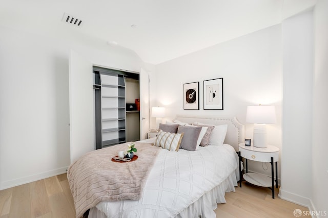 bedroom featuring a closet and light hardwood / wood-style floors