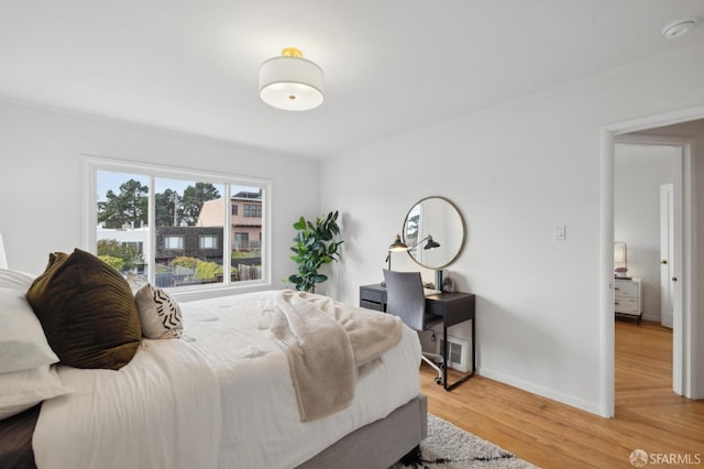 bedroom with light hardwood / wood-style floors