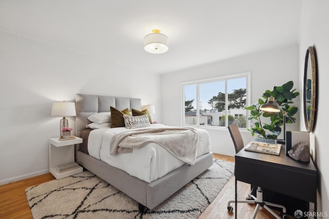 bedroom with light wood-type flooring