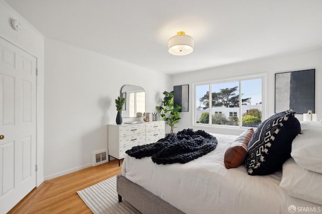 bedroom with light hardwood / wood-style flooring