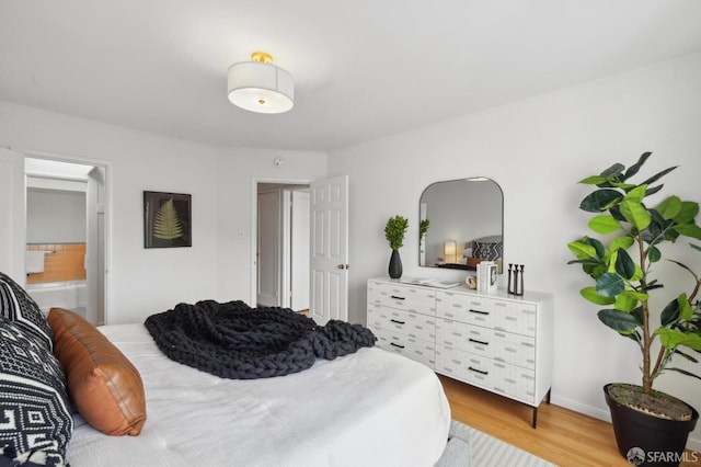 bedroom with light hardwood / wood-style floors